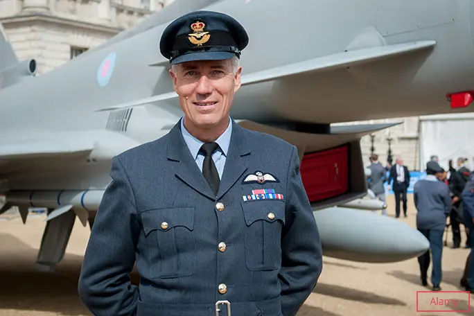 Wing Commander Green poses with a Eurofighter Typhoon at an event held to mark the RAF's 100th anniversary