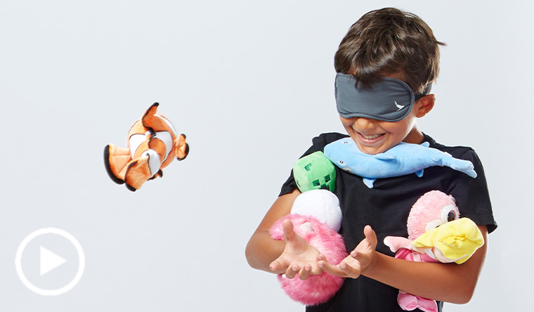 Blindfolded boy holding