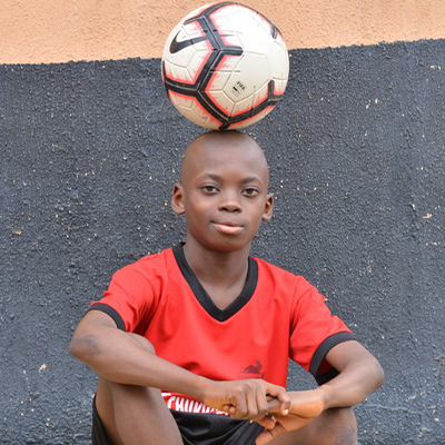 Chinonzo Eche balancing a ball on his head
