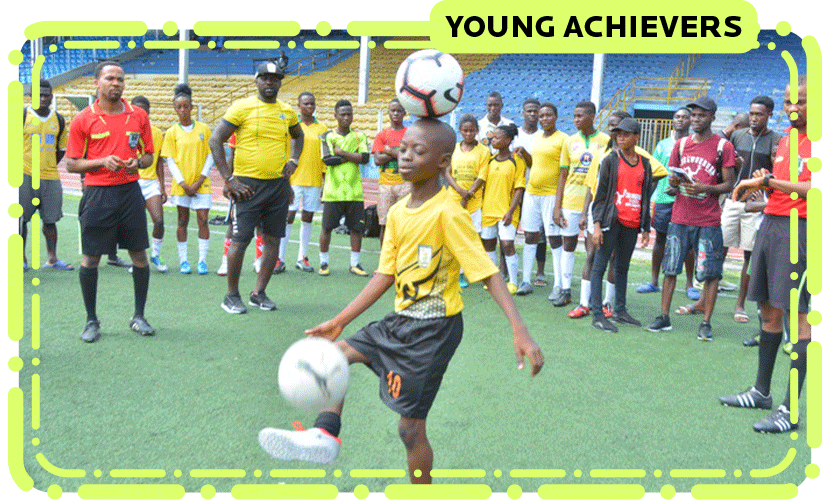 Chinonso balancing a ball on his head while doing kick ups 