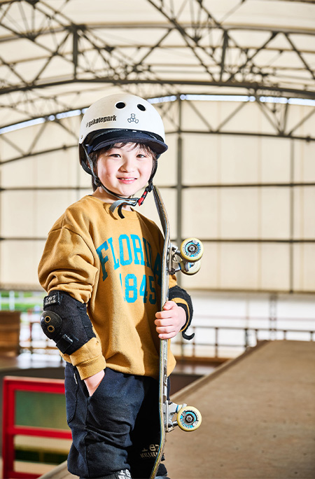 Ema posing with skateboard 