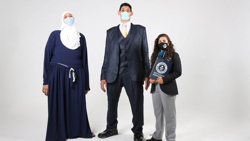 Huda and Mohamed Shehata standing next to an official adjudicator