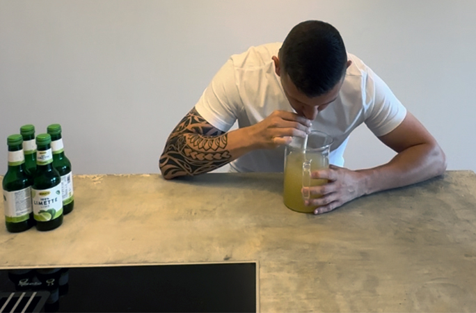 Andre drinking a litre of lime juice