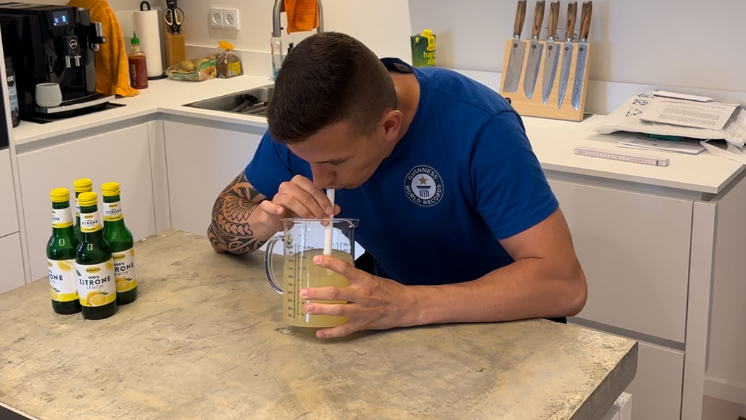 Andre drinking a litre of lemon juice