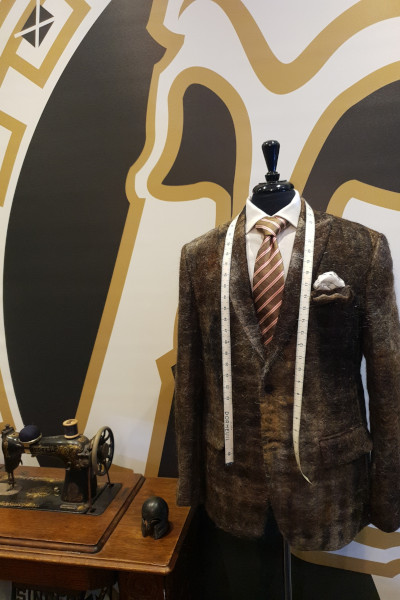 Suit displayed with sewing machine