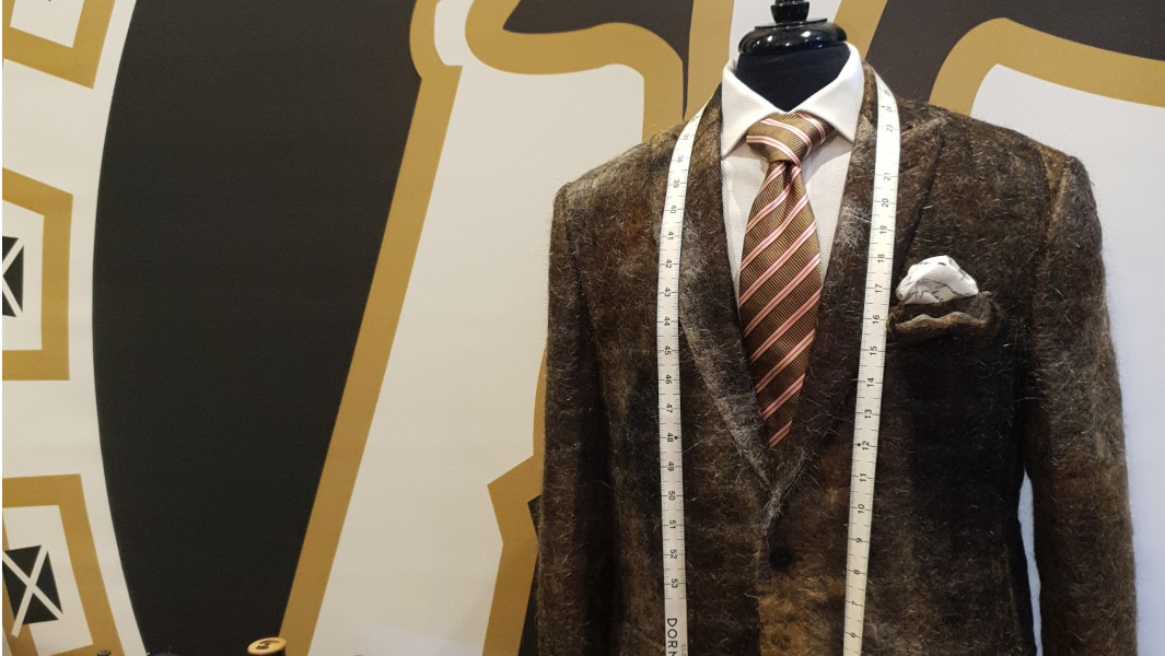 Split image of the moustache suit, close up and far away