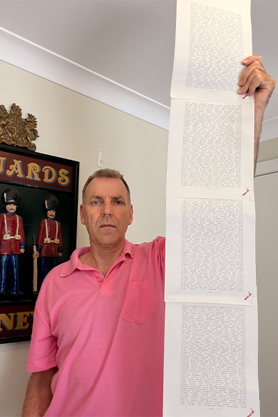 Laurence with a printout of his name