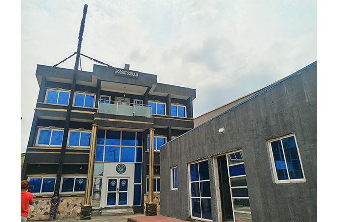 Helen wearing the wig that's taller than a building