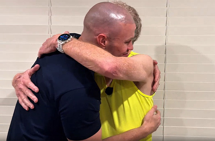 Maynard gets a hug from his son