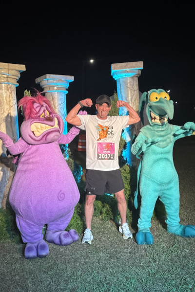 Chad smiling with Disney characters