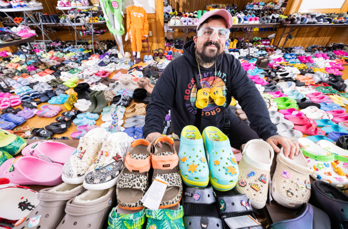 Doogie smiling in front of his Crocs