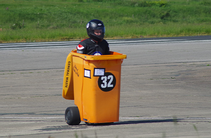 Mike in the bin with a helmet on
