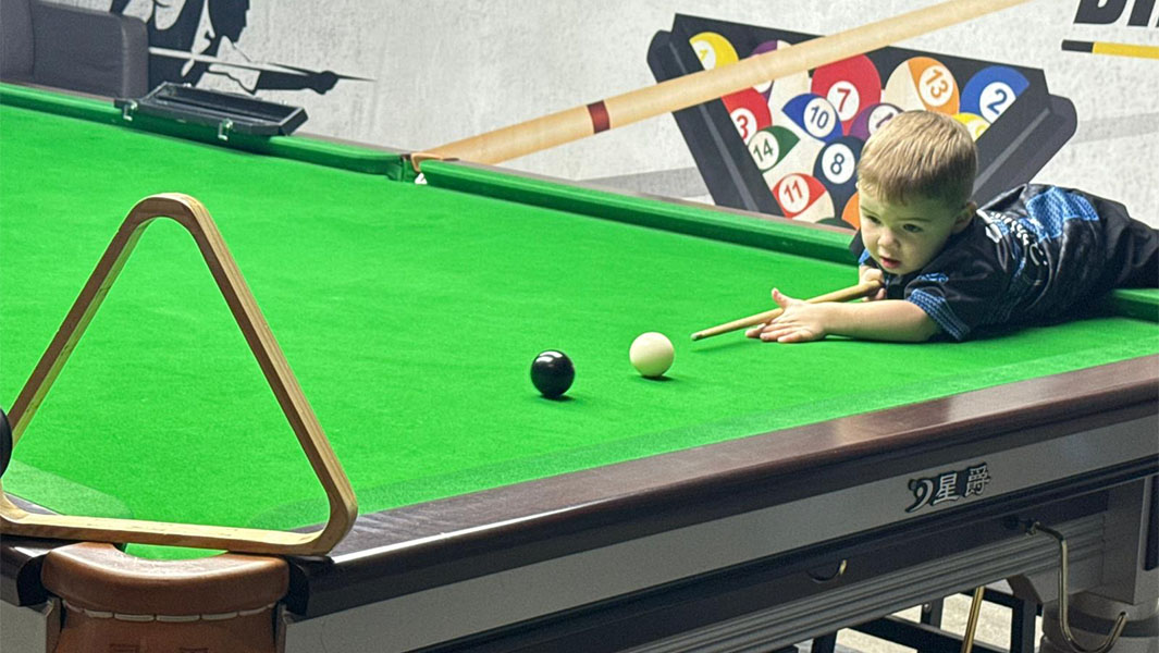 split image of Jude with his certificates and sitting on a snooker table