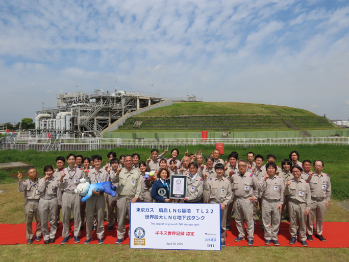 Staff of Tokyo Gas staff in front of the largest in-ground LNG tank