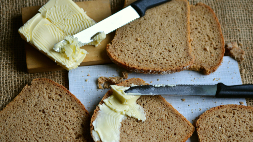 loafs of bread next to butter 