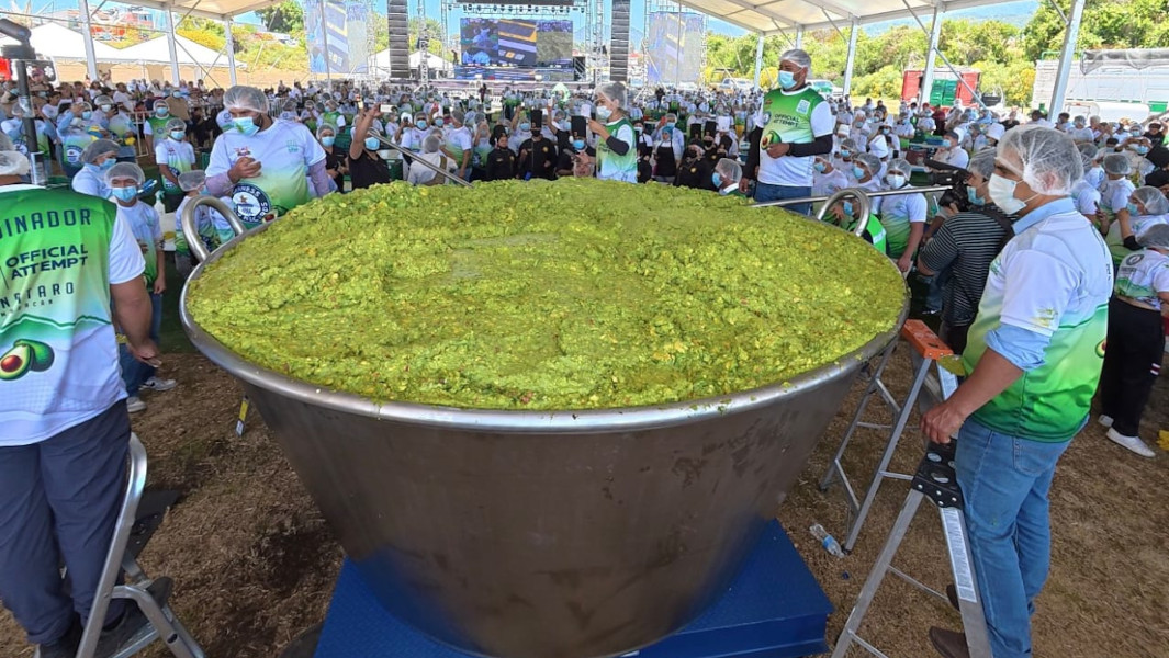 Close up image of the largest guacamole being stirred