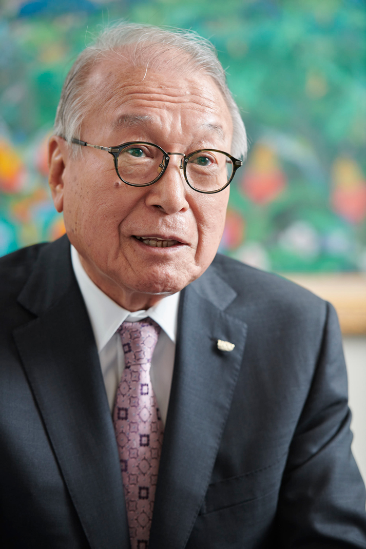 man in suit and glasses in mid conversation