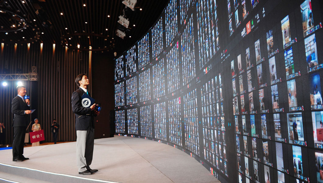 adjudicator looking at massive screen