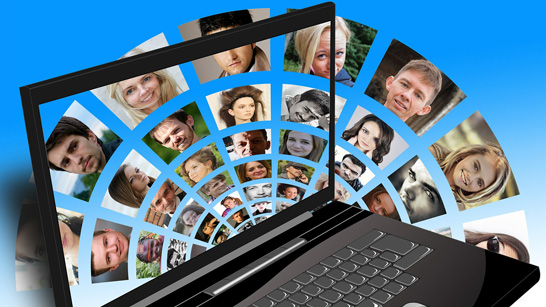 cartoon laptop with selfies of people coming out of the screen