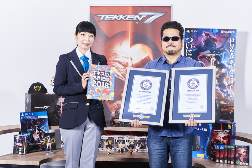 katsuhiro holding gwr certificates next to adjudicator