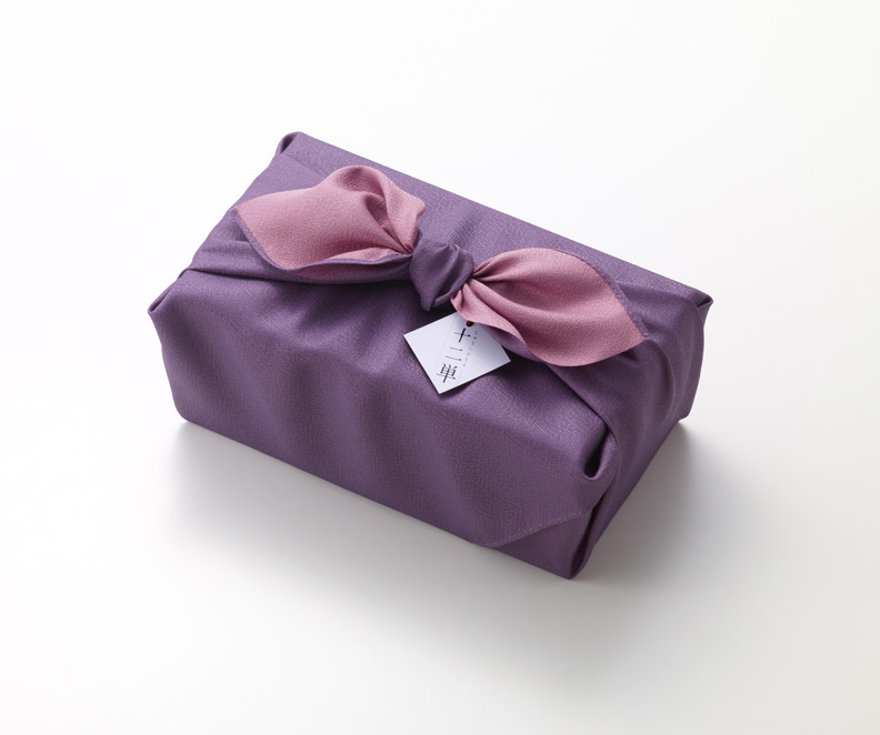 purple box with ribbon