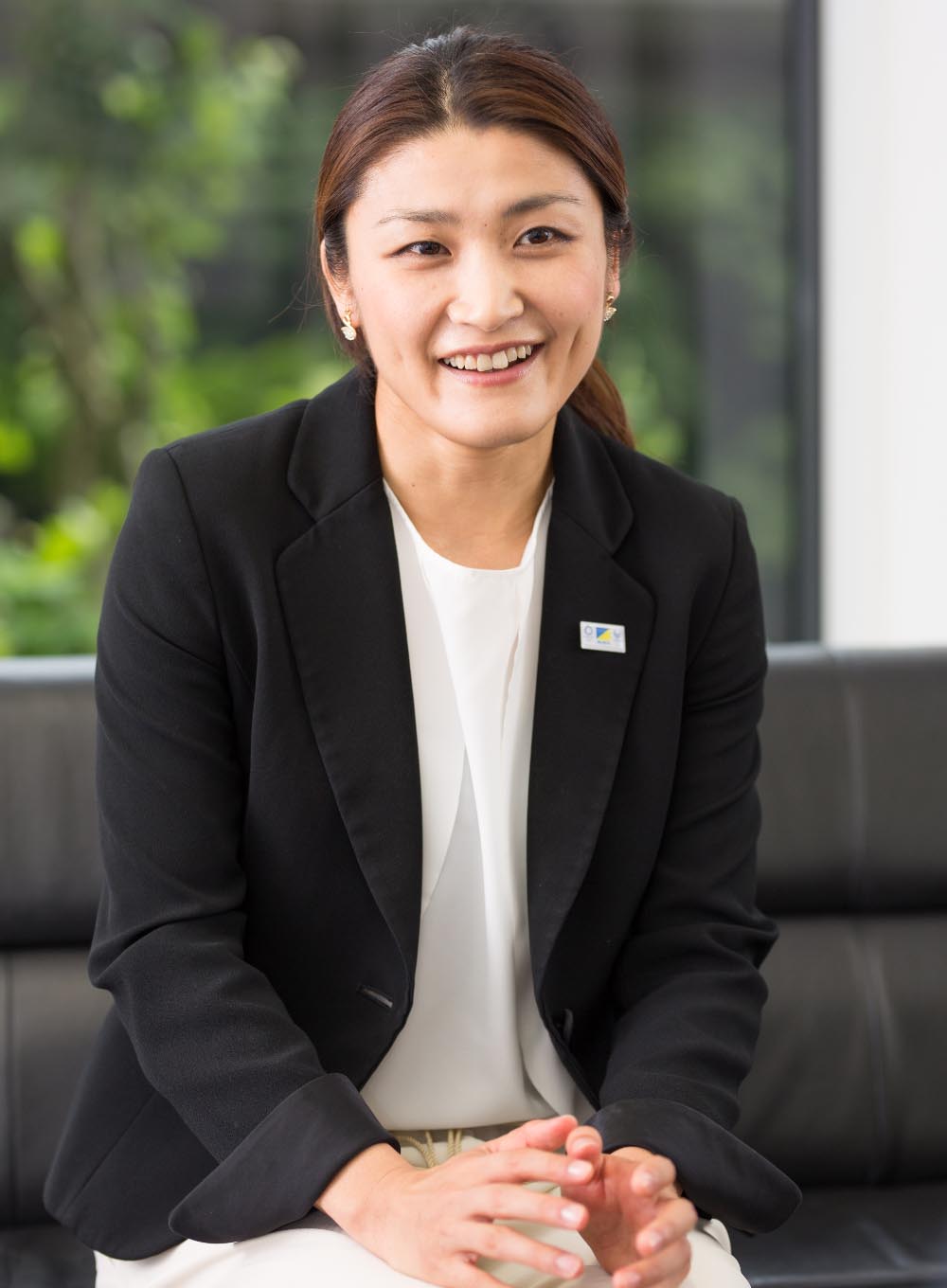 kaori smiling in black blazer