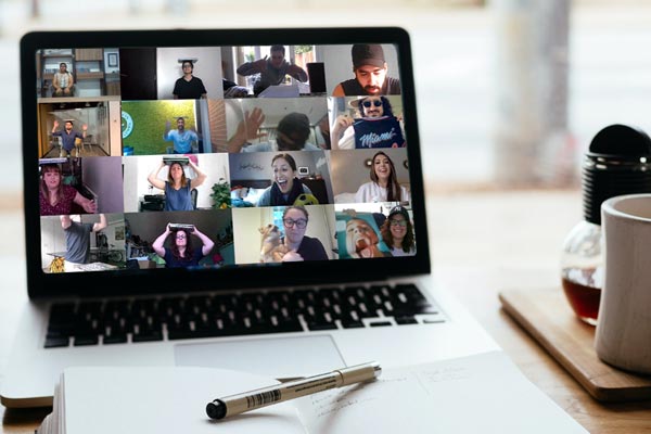 people on video call on laptop